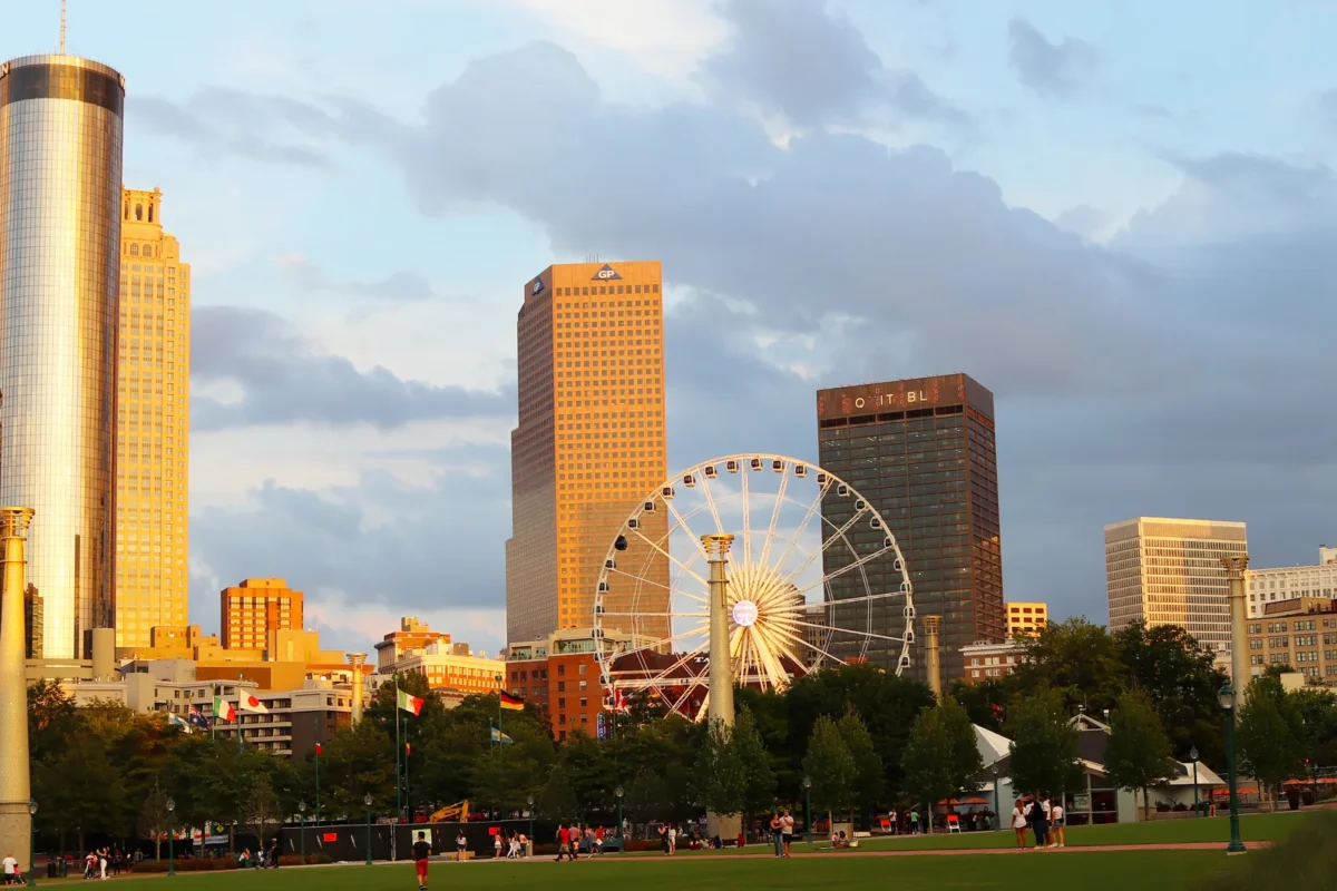Atlanta skyline rising above the trees of Piedmont Park, home to many Atlanta landmarks every local should visit
