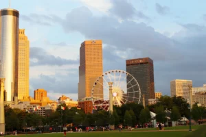 Atlanta skyline rising above the trees of Piedmont Park, home to many Atlanta landmarks every local should visit