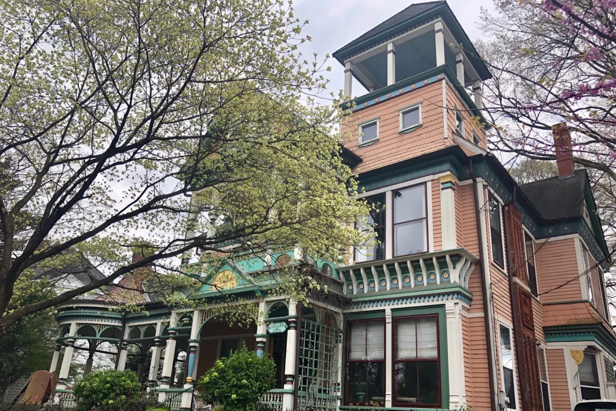 Victorian home on a tree-lined street, illustrating the Inman Park vs Old Fourth Ward neighborhood comparison in Atlanta