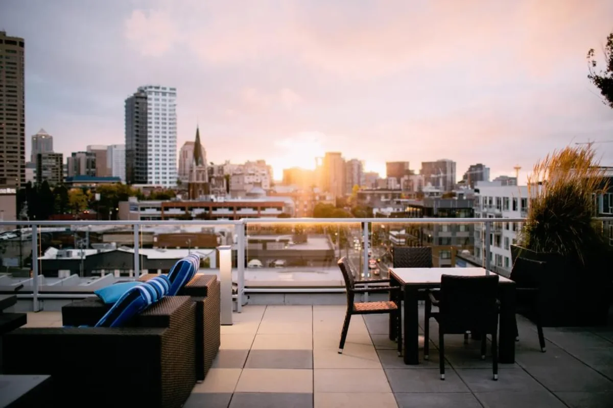 City skyline at golden hour seen from a quiet perch, one of the best rooftop views without the crowds