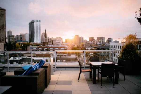 City skyline at golden hour seen from a quiet perch, one of the best rooftop views without the crowds