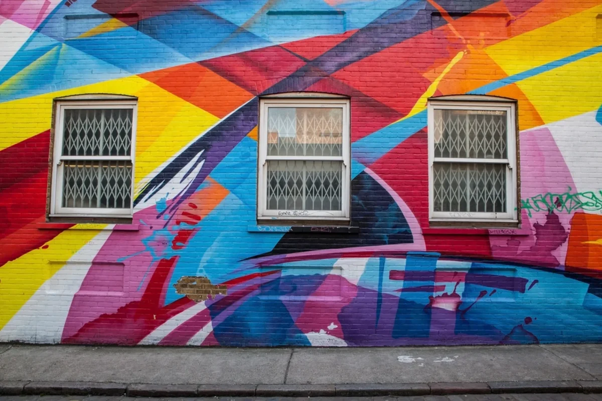 Colorful street mural on a brick wall in one of the underrated art enclaves of an American city