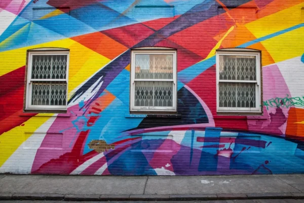 Colorful street mural on a brick wall in one of the underrated art enclaves of an American city