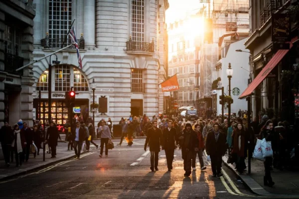 People exploring a walkable neighborhood street with local cafes, illustrating what is RegalBuzz and the city life it covers